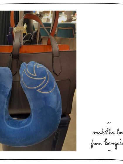 Padma's Mahitha tote in Anchor Rouge, ready for travel. This large tote is perfect for carrying everything you need for a flight.