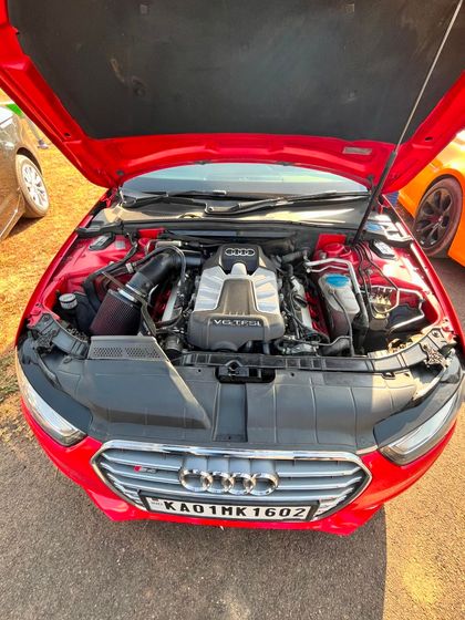 An open-hood shot of a powerful Audi engine, a common sight at our enthusiast gatherings.