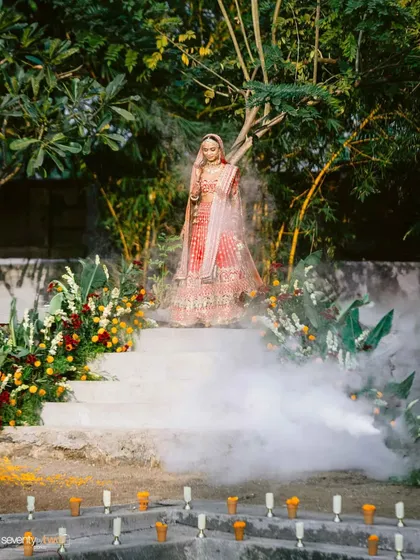 The bride's dramatic entrance down a smoke-filled staircase to the 'kund' where her wedding ceremony will take place. A truly magical and unforgettable moment.