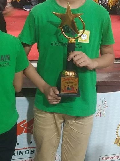 A close-up of a champion's trophy from the Zonal Competition. This award symbolizes not just a win, but the journey of growth, perseverance, and personal excellence.