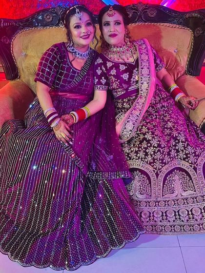 Mother and daughter goals. Both clients are looking gorgeous in their rented lehengas, one in a deep purple velvet and the other in a striped sequin design.