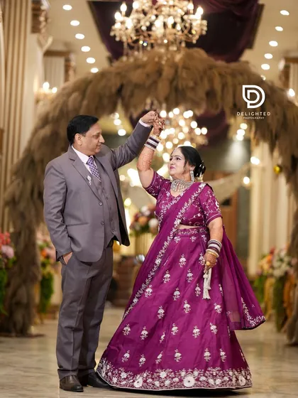 Celebrating 25 years of love, this couple shares a dance during their silver jubilee anniversary party, proving that beautiful moments are worth capturing at every stage of life.