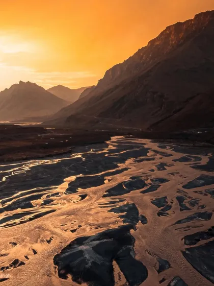 Another angle of the fiery sunset in Spiti Valley. This frame focuses on the way the golden light catches the edges of the mountains, creating a sense of immense depth and scale.