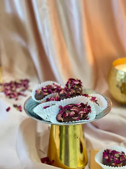 My Shahi Khajoor is a true festive delicacy. I take premium Afghani dates, stuff them with a roasted almond, coat them in silky chocolate, and hand-roll them in a bed of dried rose petals.