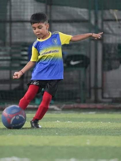 Tiny tot, mega shot. This young player is already showing incredible power and technique.