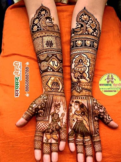 This design showcases a playful moment between the bride and groom, captured in henna. The arms are filled with traditional elements like peacocks and kalash pots, blending personality with tradition.