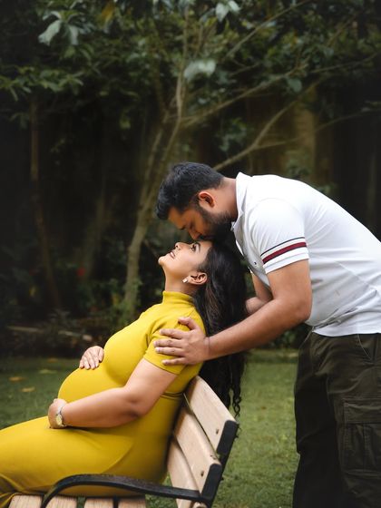 A sweet moment of affection during an outdoor park session. I gently guide couples into poses that feel intimate and genuine, capturing the love and support they share.