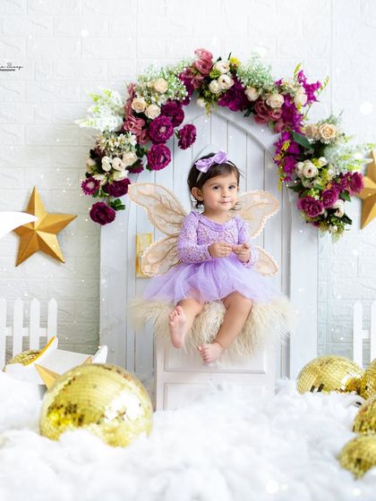 A pensive moment for our little fairy, sitting on her moon prop. This dreamy setup provides a beautiful backdrop for a variety of poses.