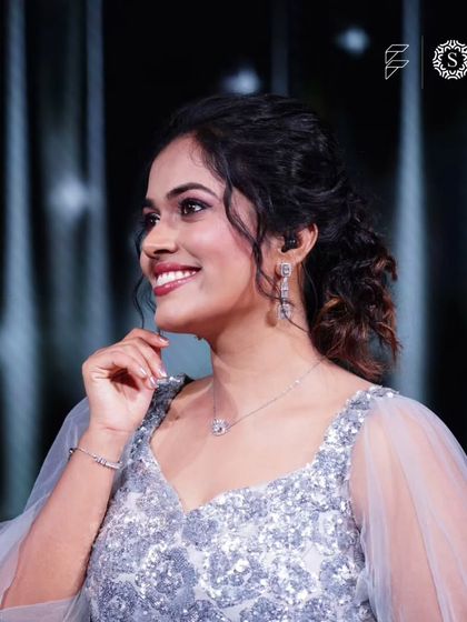 A candid shot of Sayli Kamble looking happy and confident in our rental gown and jewellery. We love helping our clients shine.
