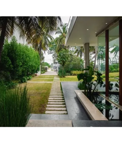 Where architecture meets tranquility. A seamless blend of nature and design, this pathway with a water feature leads you on a journey into serenity.