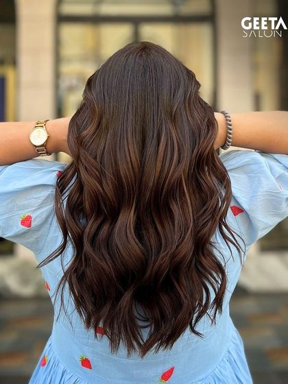 A stunning example of long, healthy hair with a uniform, rich brown colour and perfect waves.