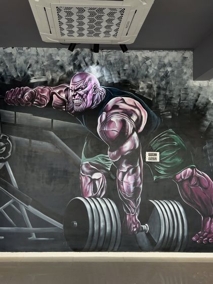 The finished Thanos mural, ready to inspire some heavy lifting. I focused on muscle definition and an intense expression to capture the character's power.