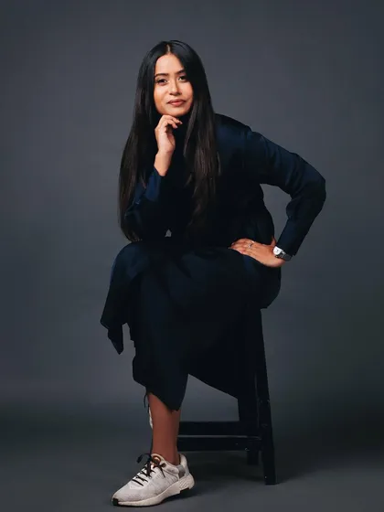 A seated pose that is both powerful and relaxed. This is a great look for an entrepreneur or team leader.