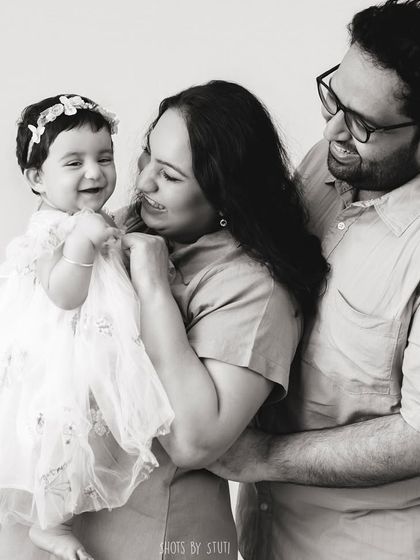 The same moment of joy, in timeless black and white. Stripping away the color often enhances the emotion, making the connection between the family members the central focus of the photograph.