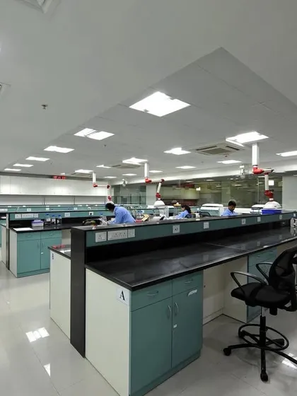 An R&D laboratory space with long benches and specialized equipment. Our design ensures a clean, safe, and efficient environment for scientific work.