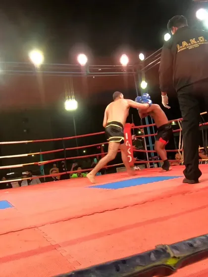 The moment the opponent's corner threw in the towel. A clear and decisive victory for our fighter.