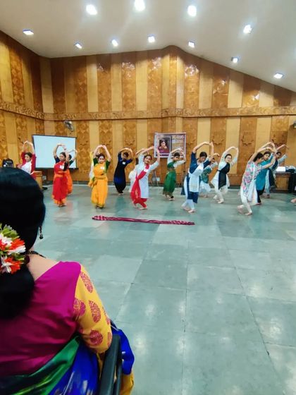 From my perspective as a teacher, I watch my students practice their movements. Guiding them from the front of the class allows me to correct their form and ensure they embody the right spirit.