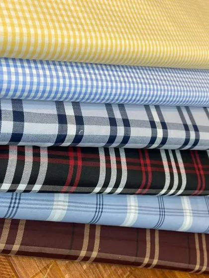 Another angle on the check shirt fabrics, highlighting the different weaves and color combinations available for your made-to-measure shirt.