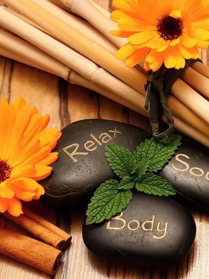 This image beautifully represents the harmony of mind, body, and soul. The relax stones, fresh mint, and warm cinnamon sticks evoke a sense of natural, holistic well-being.