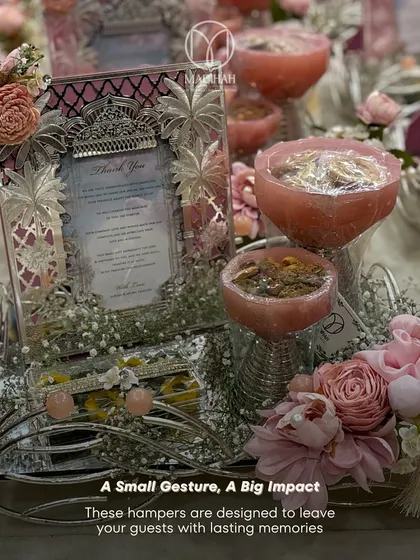 "A Small Gesture, A Big Impact." This hamper, with its delicate pink resin bowls and ornate silver frame, is designed to leave wedding guests with a lasting memory of your special day.