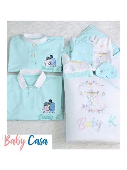 The cutest embroidered homecoming set for 'Baby K'. This coordinated collection includes a newborn outfit, a swaddle wrap, and matching shirts for Mommy and Daddy.