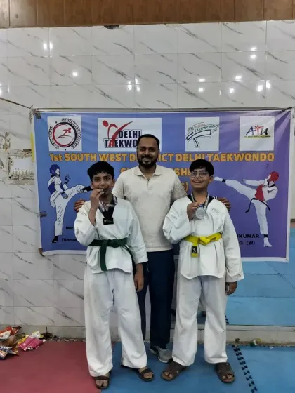 Two of our junior students with their medals at the district-level selections. We nurture talent from the grassroots level.
