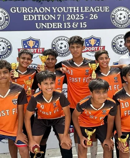 The champion U13 Blue team with their coaches, celebrating a well-deserved victory in the Gurgaon Youth League.