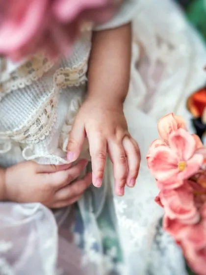 A macro shot focusing on the delicate, tiny hands of a baby. I love capturing these small details that you'll want to remember forever.
