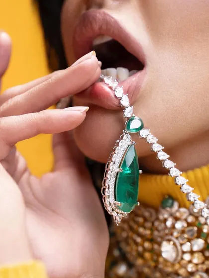An edgy and provocative close-up from our emerald pendant campaign. This kind of creative direction helps a brand stand out by creating a bold and unforgettable image.
