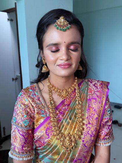 Priyanka's stunning reception look. The makeup is slightly more dramatic than her wedding look, with a focus on the eyes to create an elegant evening vibe.