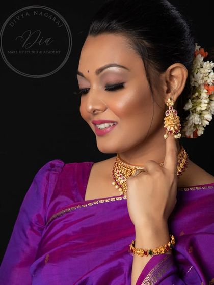A lovely, smiling shot that shows the joy and beauty of this traditional look. The makeup is soft enough to look natural while still feeling special and elegant.