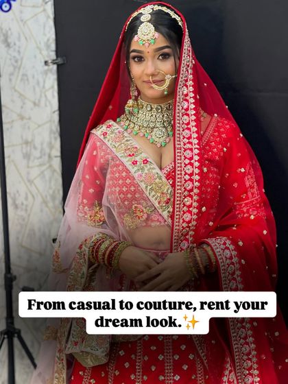 Another angle of this gorgeous red bridal lehenga, showing how the double dupatta style adds layers and dimension to your outfit.