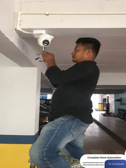 We believe in quality workmanship. Here, one of our technicians is performing a meticulous CCTV camera installation, ensuring optimal placement and secure mounting for reliable, long-term performance.