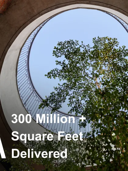 With a legacy spanning 60 years and over 300 million square feet of delivered projects, our experience is the foundation upon which we build. This oculus, framing a tree within the building, symbolizes our philosophy of integrating nature and structure, a hallmark of our work across numerous large-scale institutional projects.