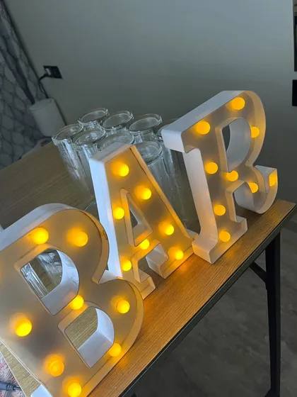 Our illuminated 'BAR' sign is the perfect add-on to any setup, big or small. It instantly creates a focal point and adds a professional touch.