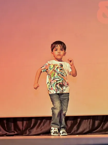 A dynamic action shot of Yuvaan during his energetic dance routine.