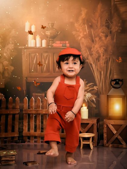 A happy dance in his rustic-themed birthday setup. The warm, earthy tones and soft lighting create a beautiful and natural feel.