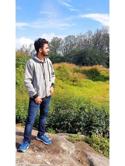 Posing against the lush greenery of Nandi Hills. It's a perfect backdrop for those profile picture worthy shots.
