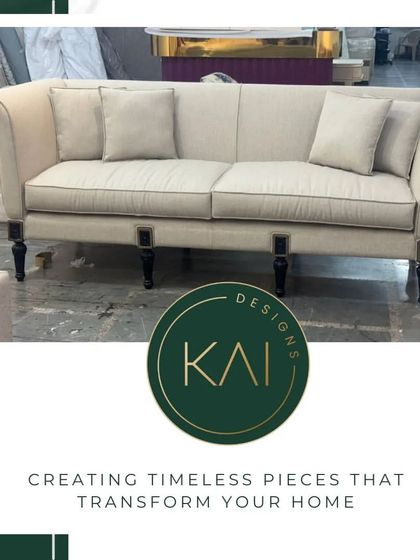 A classic English roll-arm sofa in a light neutral fabric with dark turned legs. This piece showcases traditional craftsmanship and offers a comfortable, timeless aesthetic for any home.