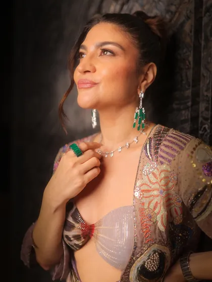 This look is all about high-fashion elegance. I created a clean, sculpted face with a subtle glow, a sophisticated updo, and minimal color to let the client's natural beauty and stunning jewelry take center stage.