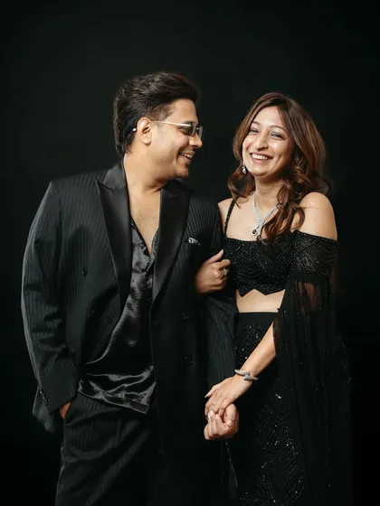 This image captures a beautiful, spontaneous moment of laughter during a studio session. The couple's genuine smiles and easy chemistry shine against the dark background, showing how I capture authentic emotions even in a controlled setting.
