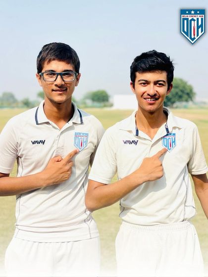 Pointing to the badge with pride. Laksh Narang and Saiansh Vohra represent the quality and spirit of the Delhi Cricket Hub. Their record-breaking performances make all the hard work worth it.