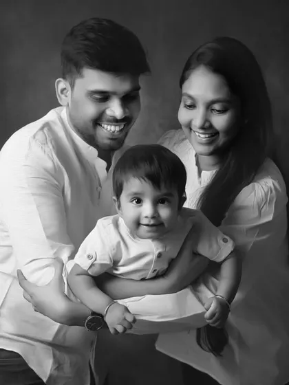 A joyful family portrait, made even more classic in black and white. The tones and composition give it a painterly quality, perfect for a framed print.