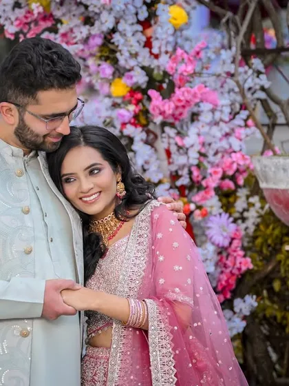 An intimate portrait of the couple, framed by beautiful pink and white flowers.