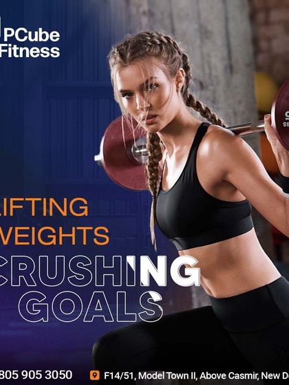 Lifting weights, crushing goals. A female member shows her strength and determination with a barbell squat.