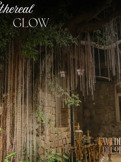 Crystal strings hang like a curtain of light from an old banyan tree, creating an ethereal, weeping willow effect. This is how I integrate lighting into the natural environment to create something truly magical.