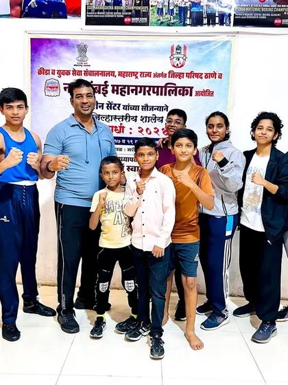 Our young boxers with their coach after the DSO tournament, tired but proud.
