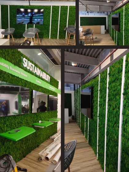 A moss wall installation for a "Sustainability" themed exhibition booth. The design incorporates integrated screens and shelving, demonstrating how we can combine technology and nature in commercial displays.