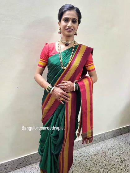 A full view of the Nauvari saree draping. This 9-yard wonder is a staple of Marathi culture, and I ensure the drape is authentic, comfortable, and graceful.