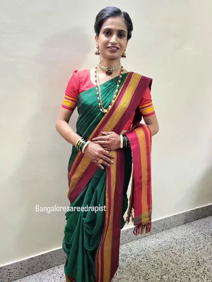 A full view of the Nauvari saree draping. This 9-yard wonder is a staple of Marathi culture, and I ensure the drape is authentic, comfortable, and graceful.